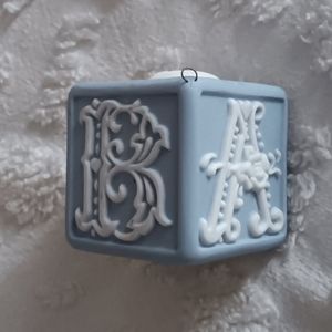 Vintage blue and white ceramic "Baby" block with hanging hook